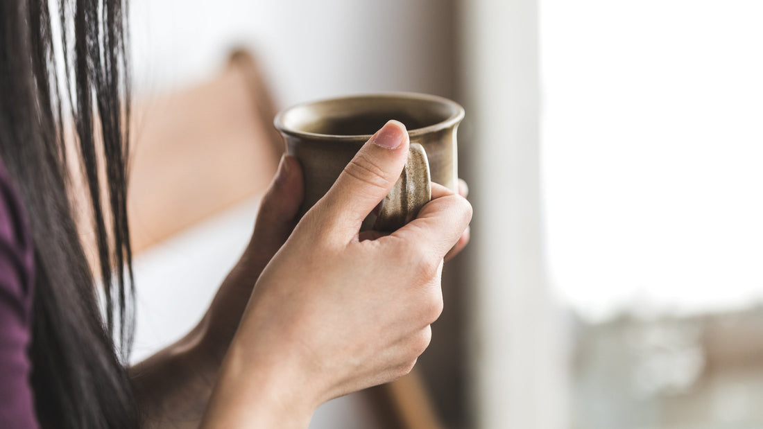 picture of a pregnant woman enjoying a decaf coffee